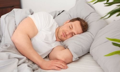 man-sleeping-comfortable-bed
