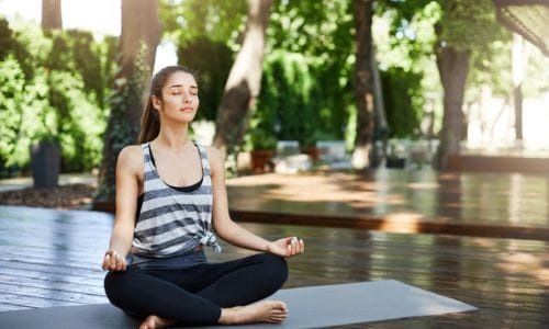 gorgeous-girl-meditating-middle-yoga-temple-breathing-deep-with-closed-eyes-basic-practice
