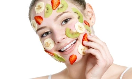 beautiful-young-smiling-cheerful-womanwith-fruit-mask-her-face-with-natural-ingerdients